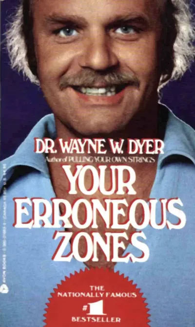 Cover of the book "Your Erroneous Zones" by Wayne Dyer in bold red lettering, representing love songs as a trauma survival strategy